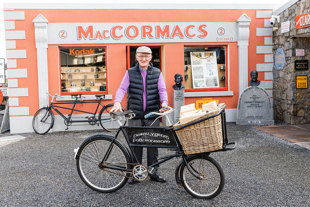 Charlie Finneran in front of Maccormacs shop with a vintage bicycle
